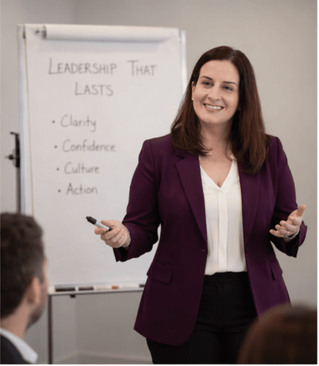 Amelia Ghofrany facilitating a leadership workshop in front of a flip chart